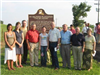 Group standing in front of the marker