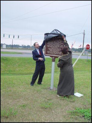 Carolyn Brown uncovering the historical marker